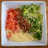 Burrito Bowl · Rice, black beans, choice of meat, lettuce, cheese, and tomatoes.