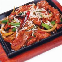 Sizzlings Mongolian Beef · Quickly cooked beef and onions in house sauce served on a hot iron plate. Hot and spicy.