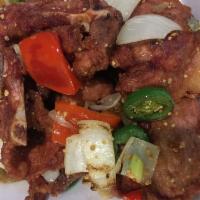 Black and White Chop · Light fried pork chop tossed with salt and pepper. Hot and spicy.