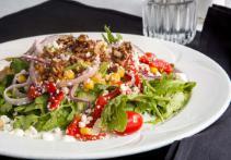 Arugula Salad · Arugula roasted red peppers, roasted corn, caramelized pecans, red onions, tomatoes, goat ch...