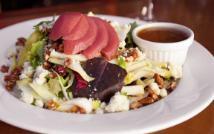 Poached Pear and Gorgonzola Salad · Mixed field greens, poached pears, endive, Gorgonzola, caramelized pecans and Italian vinaig...