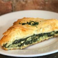 Spanokopita · Spinach pie with feta and herbs baked in phyllo dough. 