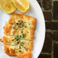 Saganaki · Fried kefalograviera cheese seasoned with lemon and olive oil. Add tzatziki for an additiona...