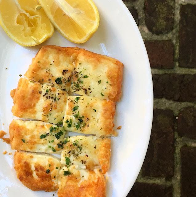 Saganaki · Fried kefalograviera cheese seasoned with lemon and olive oil. Add tzatziki for an additional charge. 