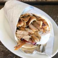 Chicken Gyro Pita Sandwich · Slow roasted chicken breast, topped with tomato, red onion, fresh cut fries and tzatziki sau...