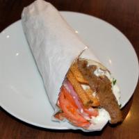 Bifteki Pita Sandwich · Greek style freshly ground beef skewer seasoned with herbs and spices. Topped with tomato, r...