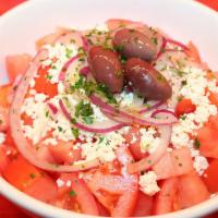 Tomato Salad · Tomato, red onion, feta, and Kalamata olives. Add-ons for an additional charge. 
