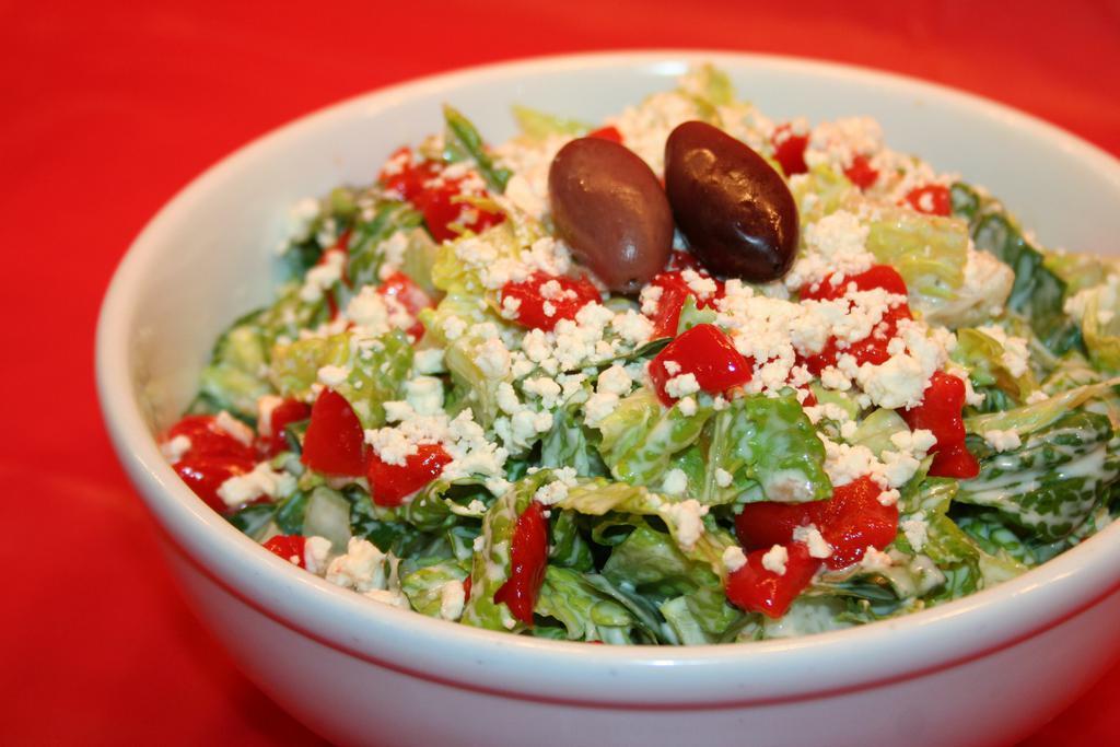 Something Greek Signature Salad · Romaine lettuce, roasted red peppers, crumbled feta, topped with our signature sauce. Add-ons for an additional charge. 