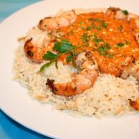 Shrimp Santorini Special · Baked in a light tomato sauce with herbs, spices and feta cheese, served over rice pilaf. 