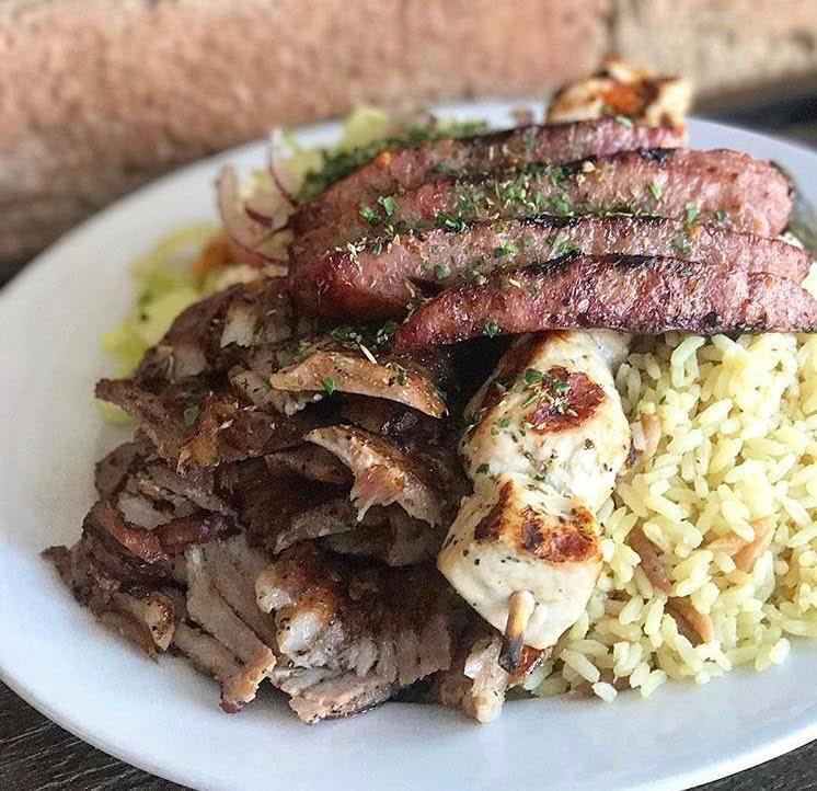 Mixed Grill Platter · Gyro, souvlaki and loukaniko. Includes a choice of rice or fries, with horiatiki salad. Served with 1 pita bread and a small tzatziki sauce. Extra sauce and pita for an additional charge. 