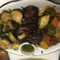 Grilled Hanger Steak · With chimichurri sauce and 2 Zaca sides.