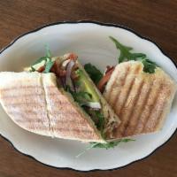 Chicken Panini · Swiss cheese, bacon, avocados, red onions, arugula, tomatoes with French mustard vinaigrette.