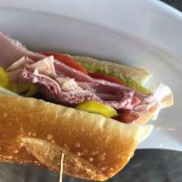 Big Mouth Hoagie · Ham, salami, turkey, Provolone cheese, yellow peppers, lettuce, tomato, red onion and Italia...