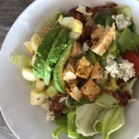 Iceberg Cobb Salad · Crisp iceberg, rotisserie chicken, bacon, tomato, avocado, chopped eggs, Gorgonzola cheese a...