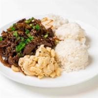 Teriyaki Steak Plate · Steamed white rice, marinated ribeye steak, teriyaki sauce, sesame seeds, and green onions. ...