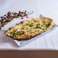 Garlic Naan · Tandoori naan topped off with garlic and cilantro.