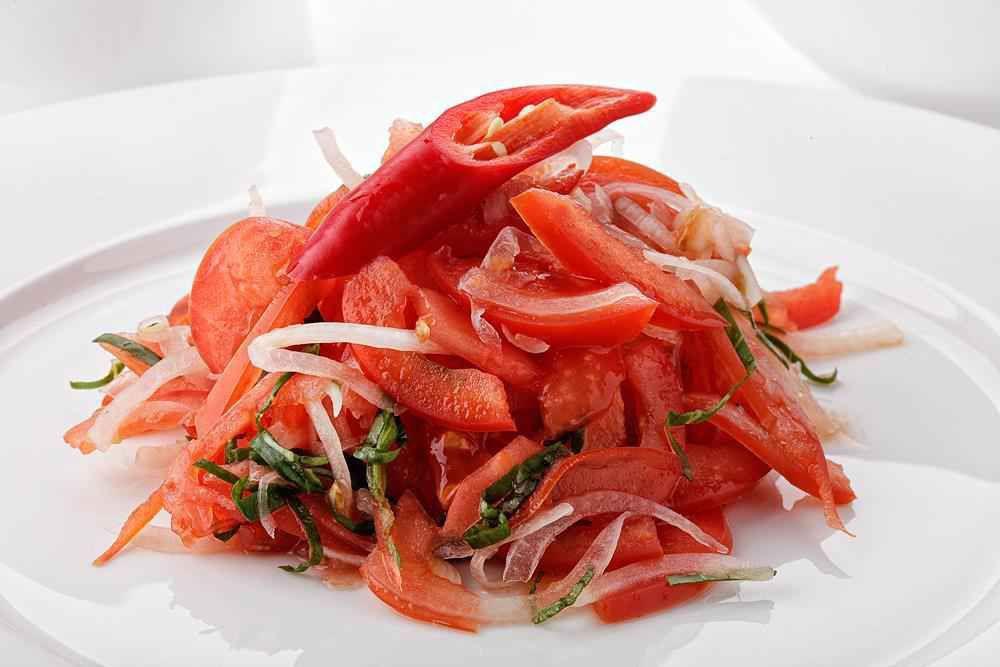 Achichuk Tomato Salad · Tomatoes, peppers, onions, seasoned with spices.
