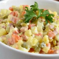 Olivye Salad · Authentic Russian olivye is a salad made with boiled potatoes, carrots, and eggs mixed with ...
