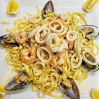 Seafood Fettuccine in White Sauce · Shrimp, mussels, and calamari.