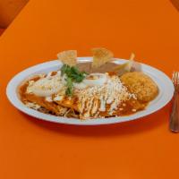 Enchiladas Rojas de Pollo · Tortillas stuffed with chicken dipped in our home style spicy tomato salsa, folded in 1/2, g...