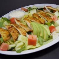 House Salad · A blend of freshly cut iceberg lettuce, ripe tomatoes, onions and cucumbers, tossed with dre...