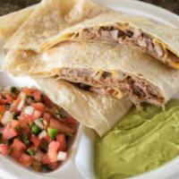 Carnitas Quesadillas · Cooked tortilla that is filled with cheese and folded in half. 