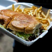 Milanesa Torta · Mexican sandwich served with guacamole, lettuce and salsa fresca and fries on the side.