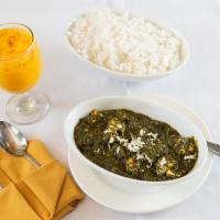 Palak Paneer · Spinach and homemade cheese cooked with Indian spices. Served with rice.