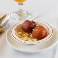 Gulab Jamoon · 2 pieces. Golden fried cheese balls served hot in rose water flavored syrup.