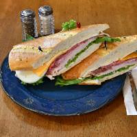 French Club Sandwich · Turkey, ham, roast beef, sharp cheddar, provolone, mayo, house mustard, and lettuce on a Fre...