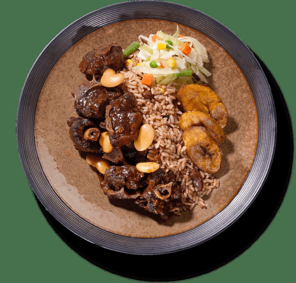 Braised Oxtail Meal · Succulent, slow-cooked, tender braised oxtail in a rich gravy that will make your rice and peas rejoice —A true favorite. CHOOSE SIDES