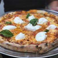 67. La Burrata Pizza · Tomato confit and fresh basil.