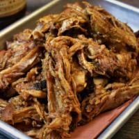 Carolina Pulled Pork LB · Pork smoked and pulled off the bone and tossed in our famous vinegar BBQ sauce. Served by th...