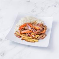 Lomo saltado · Sautéed sirloin with onions tomate, and cilantro over French fries . Serve with white rice