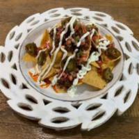 Nachos (Meat+Jalapenos+Pico+Sour Cream · Corn Tortilla chips with queso + protein of your choice + jalapenos + pico de galo + sour cr...