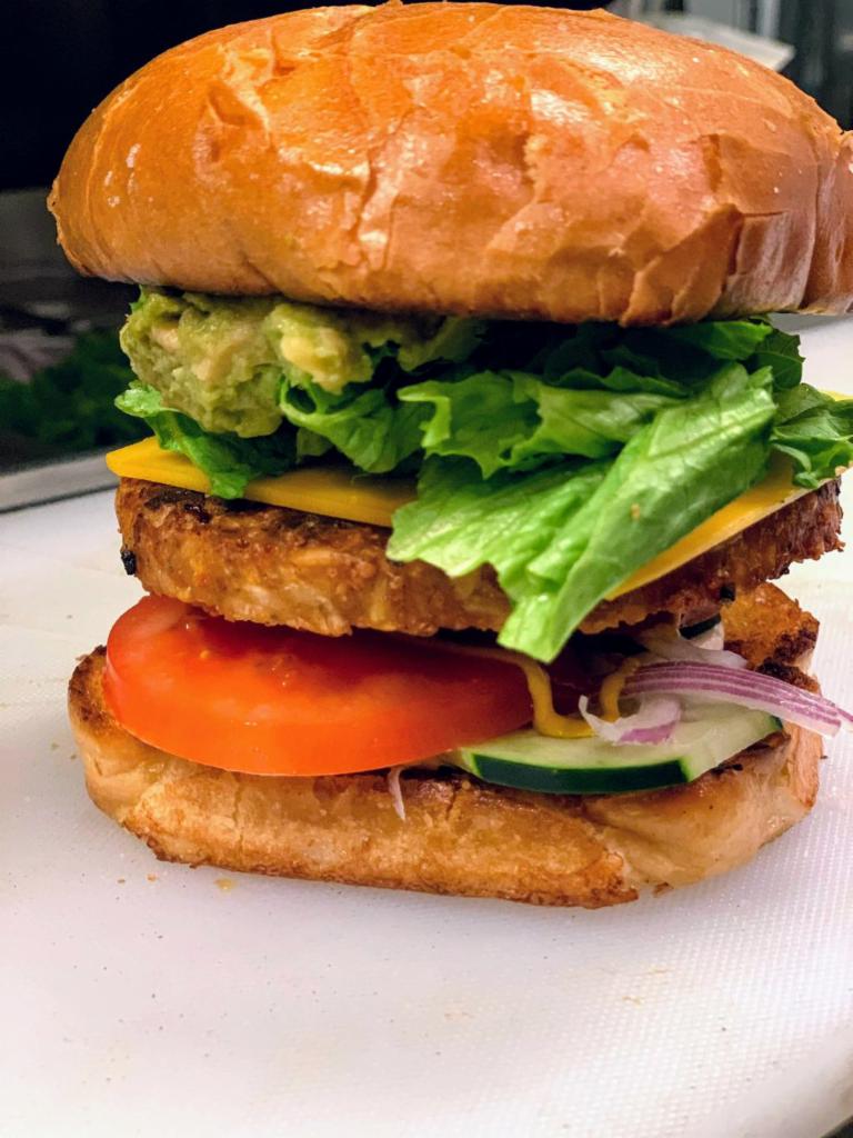 Veggie Burger · Garden Burger patty on toasted Brioche bun topped with lettuce, tomato, onion, pickle, mayonnaise, mustard, and ketchup.