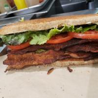 BLT Sub · A generous portion of Applewood smoked bacon with lettuce, tomato, and mayonnaise on toasted...
