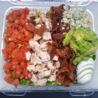 Chicken Cobb Salad · Grilled or crispy chicken, bacon, hard boiled eggs, tomato, avocado and blue cheese.