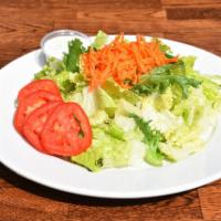 Green Salad · Romaine lettuce, spring green mix, tomato, Persian cucumber and carrots with special house d...