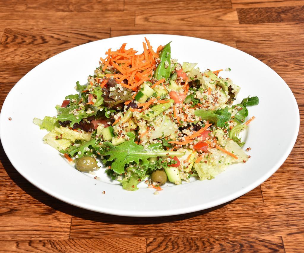 Organic Quinoa Salad · Organic quinoa cooked in a veggie stock with green mix, romaine lettuce, cucumber, tomato, olive and carrots with a special balsamic dressing. Vegetarian and gluten free.