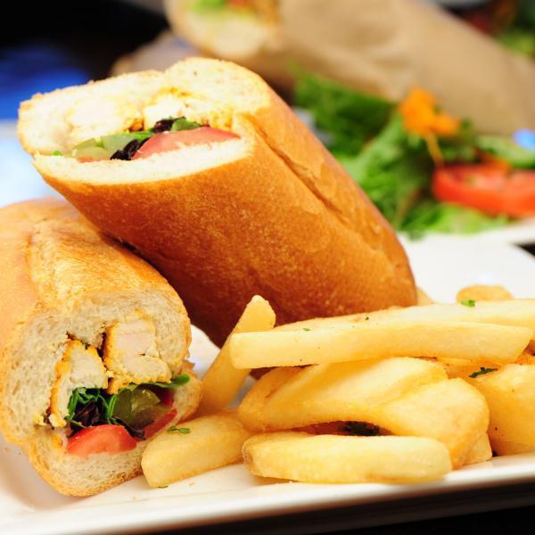 Grilled Chicken Sandwich · Grilled marinated chicken breast with lettuce, tomato, pickle and house dressing. Served in a French baguette with a choice of green salad or french fries.