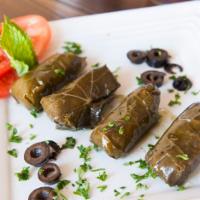 Dolmeh · Vegetarian. 6 grape leaves stuffed with rice, fresh herbs and seasoning. Served with pita br...