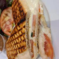 Caprese Panini · On panini bread tomato, fresh mozzarella, basil, olive oil, and balsamic drizzle.