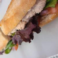 Tuna Salad Sandwich · Lettuce, tomato, and onion on a baguette.