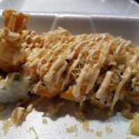 Rock and Roll · Shrimp tempura, imitation crab, avocado, asparagus and masago topped with tempura flake, spi...