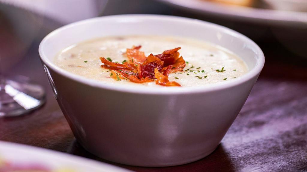 Potato Bacon Soup · This soup features fresh cream with cubed potatoes, onion, celery, and crispy bits of bacon.