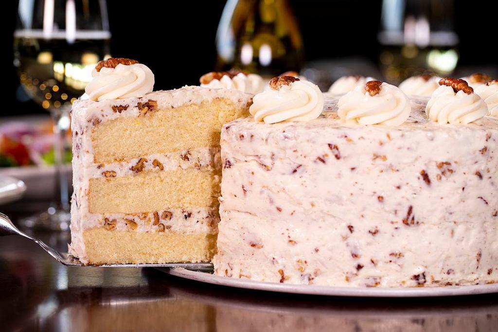 Italian Cream · Layers of yellow cake moistened with a coconut cream, then covered with our homemade cream cheese icing mixed with shredded coconut and pecans.