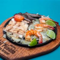 Mixed Grilled Platter · 1/2 lb. of your choice of fajitas, 4 jumbo shrimp, 4 oz. carnitas and 1/2 rack baby back rib...