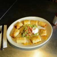 Chicken Taquitos · 8 pieces. Stuffed flour tortillas with shredded chicken and cheese deep fried and served wit...