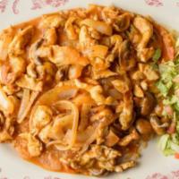 Arroz con Pollo · Chicken breast cooked in our house sauce with onions and mushroom dropped in a pile of rice.